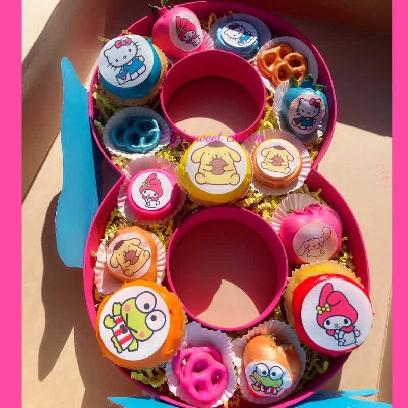 Number 8 treat box with chocolate dipped cookies, pretzels and treats topped with Sanrio character pictures
