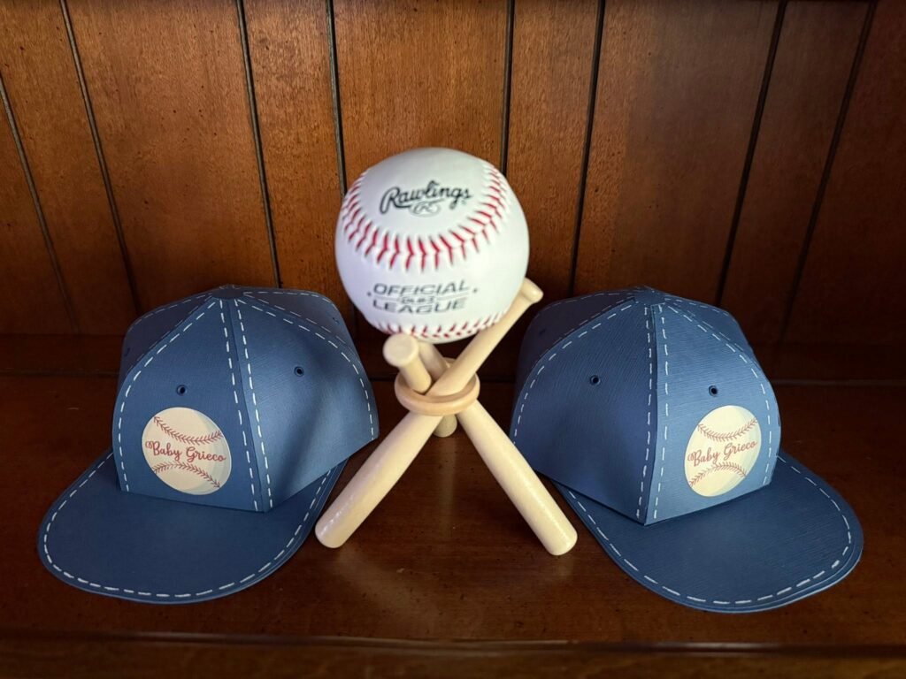 Denim baseball caps and a baseball on mini bats as baby shower decor