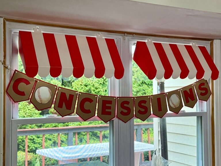 Red and white striped awning with a Concessions banner over a window