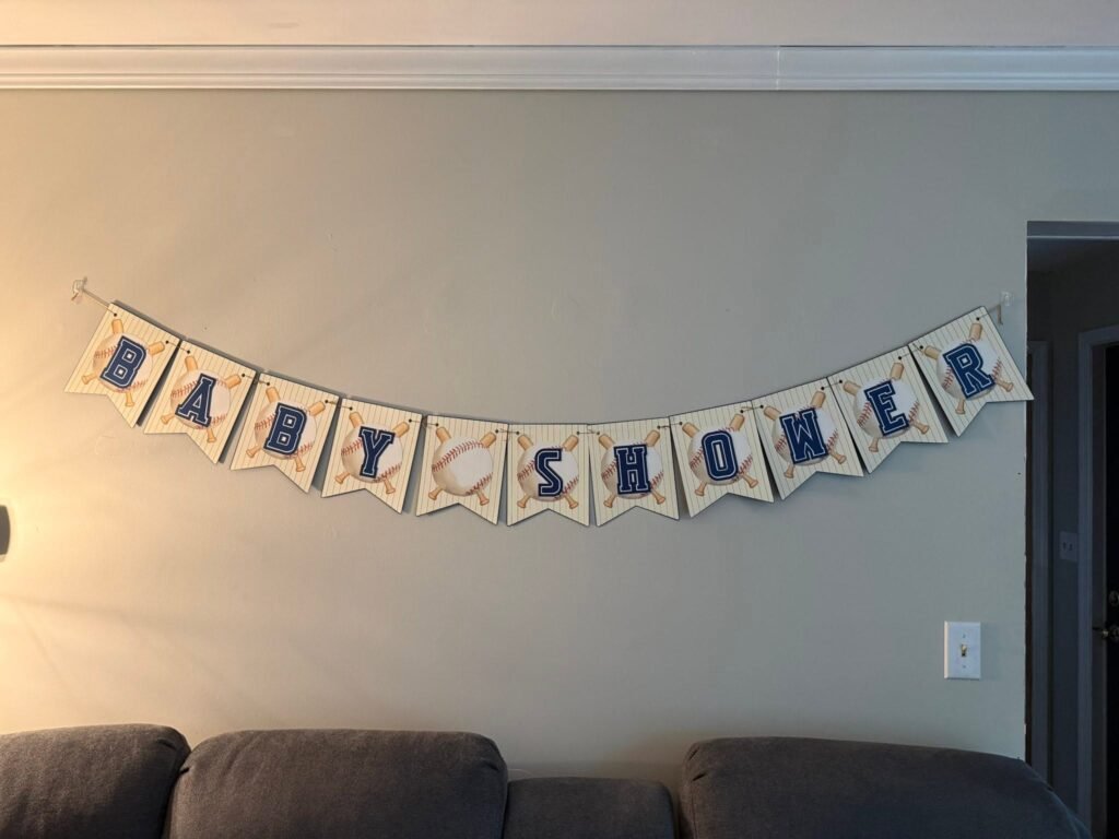 Baseball Baby Shower pennant banner on a gray wall