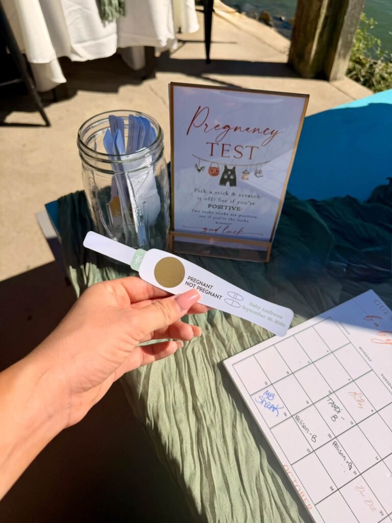 Scratch off pregnancy test baby shower game with a Pregnancy Test sign and a jar of scratch cards