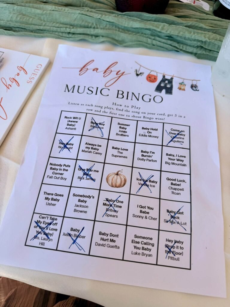 Baby Music Bingo printable card with baby song titles and a pumpkin free space