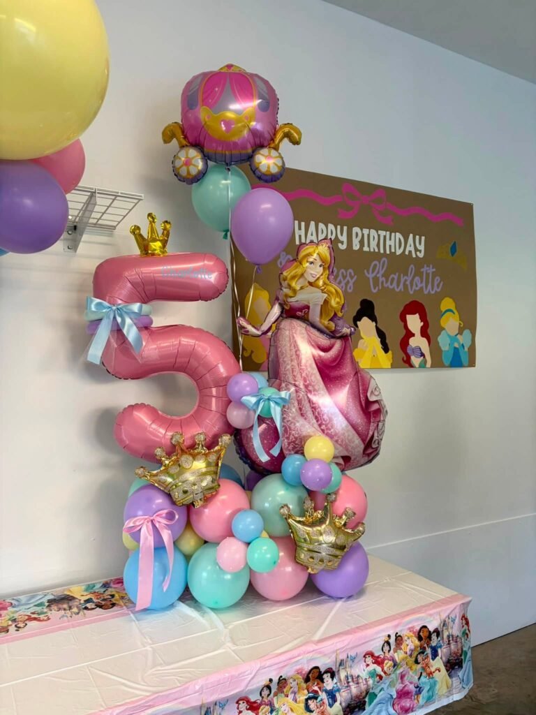 Princess balloon tower with a pink 5, a carriage balloon and a Happy Birthday princess sign