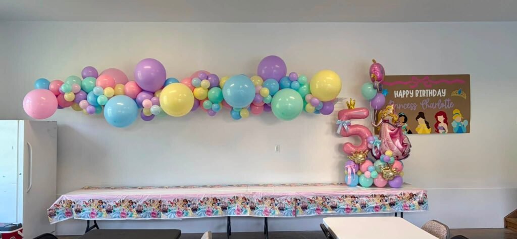 Pastel princess balloon garland and table from the left side of the room
