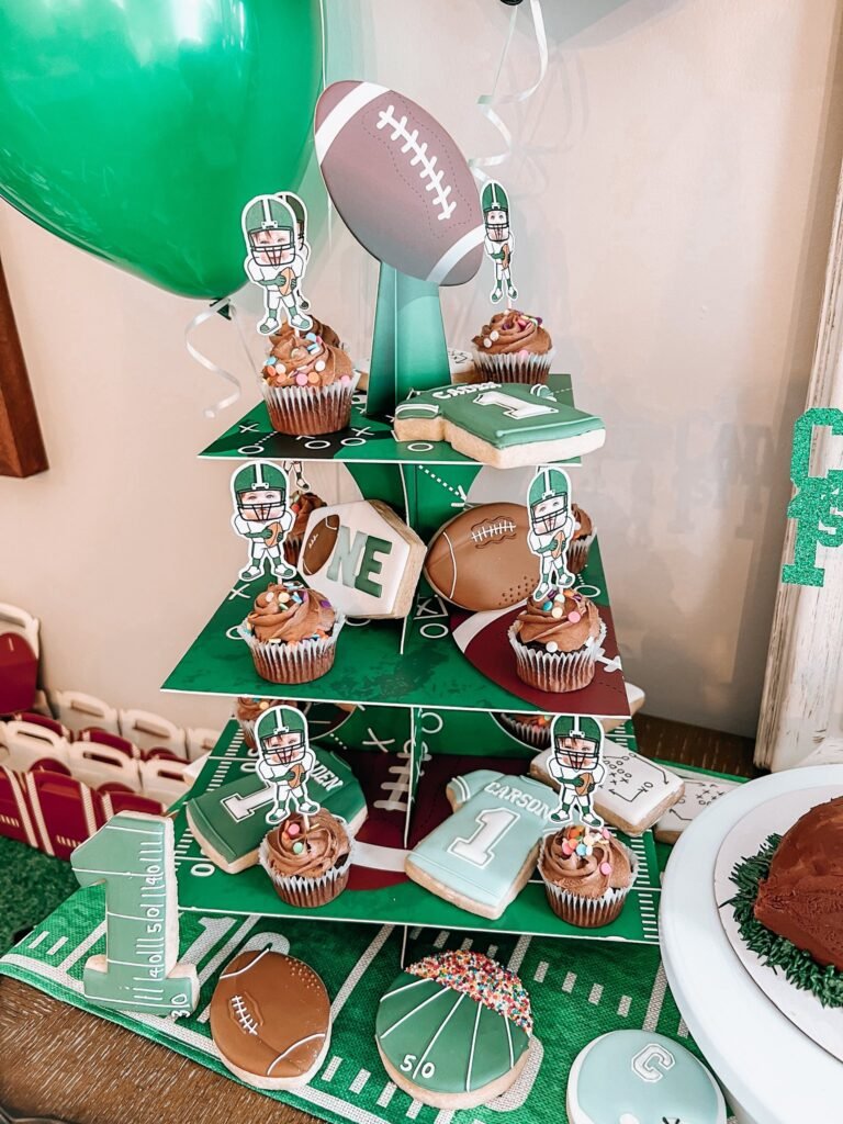 Three tier football field cupcake stand with chocolate cupcakes and player picks