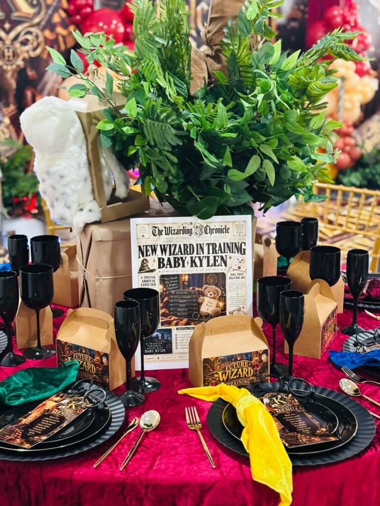 Harry Potter baby shower table with a wizarding newspaper sign that says New Wizard in Training, black chargers and house color napkins