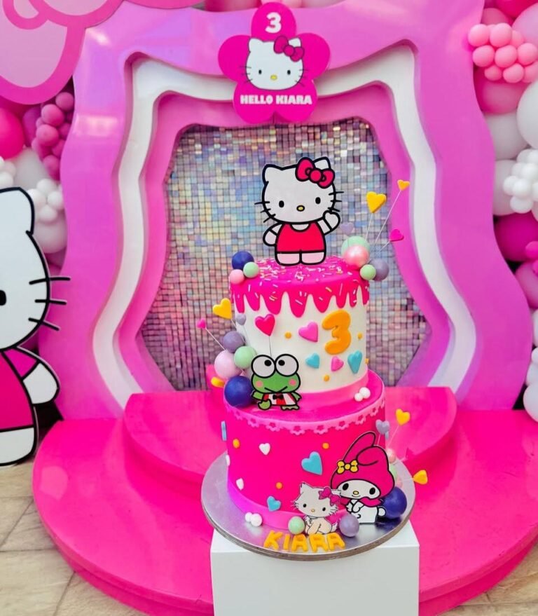 Two tier Hello Kitty birthday cake in pink and white with a number 3, Keroppi, My Melody and a Hello Kitty topper