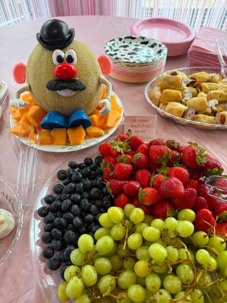 Toy Story fruit platter with a Mr. Potato Head melon, strawberries, blueberries and grapes