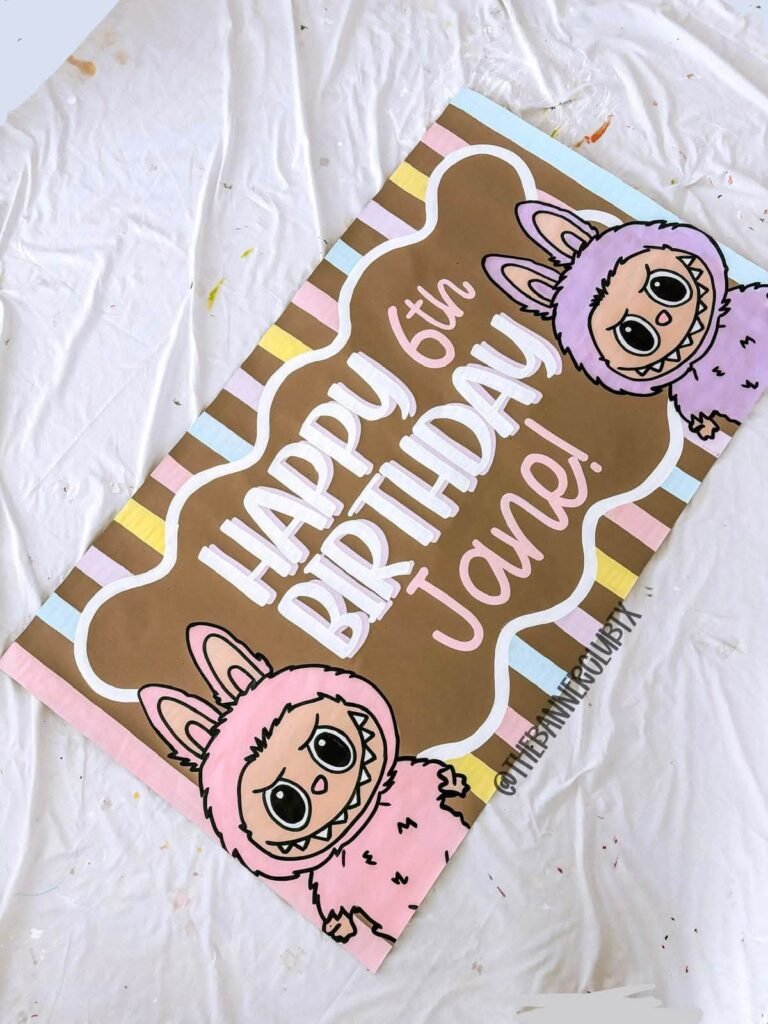 Happy 6th Birthday Labubu cookie with a brown and pink border