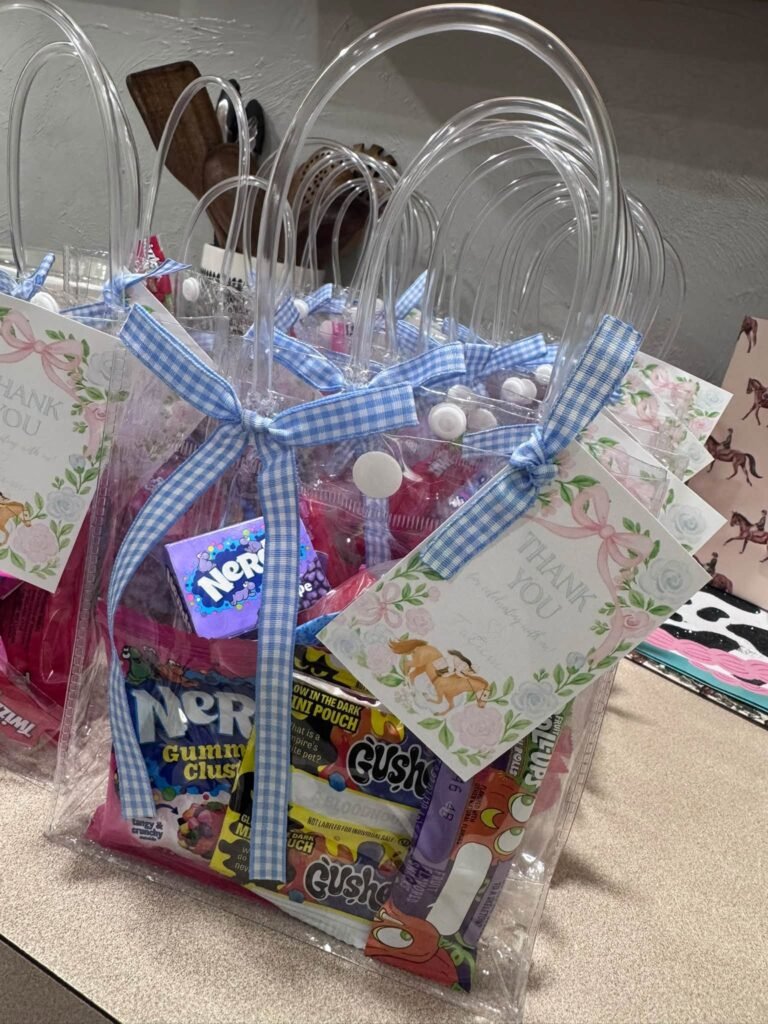 Candy favor bag with a blue gingham bow and a race themed tag