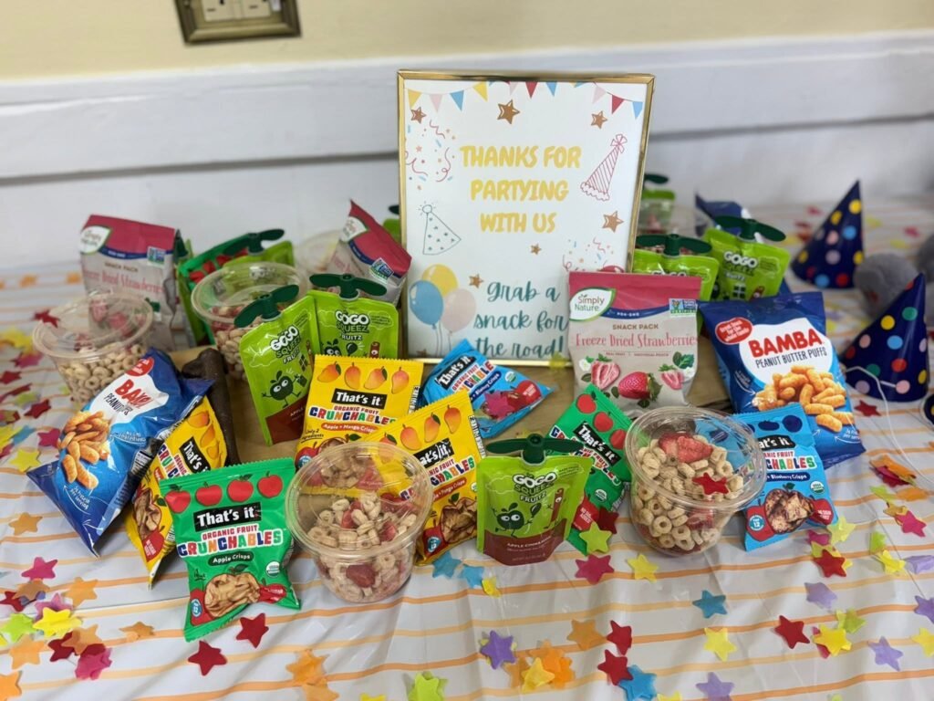 Party Animal snack table with chips, trail mix and a thanks for partying with us sign
