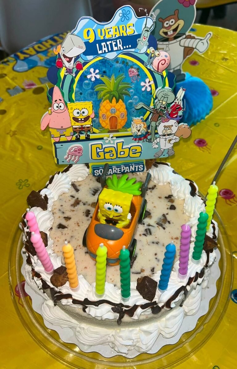 Cookies and cream birthday cake with SpongeBob topper, pineapple house and 9 Years Later sign