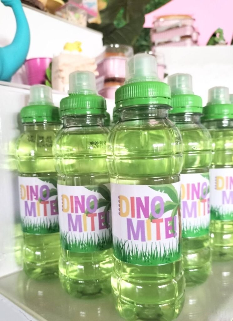 Dino Mite labeled green water bottles for a dinosaur birthday party