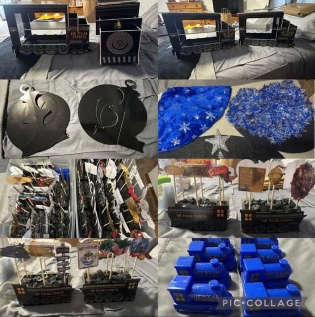 Black Polar Express train centerpieces filled with candy coal and blue train favor boxes