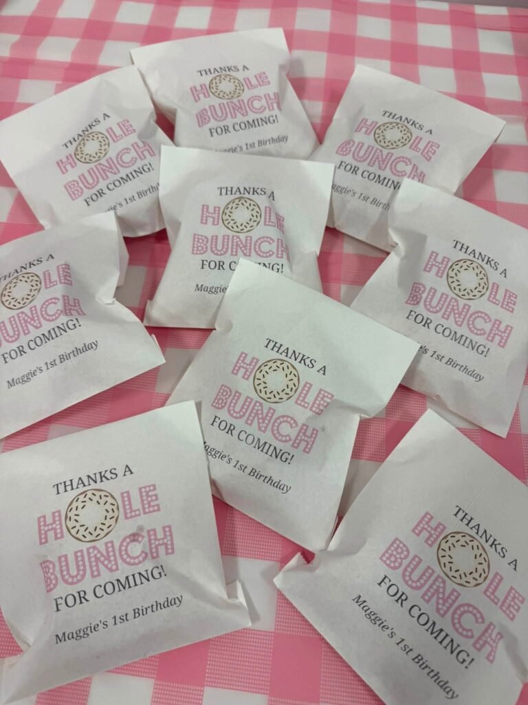 Thanks a Hole Bunch for coming donut favor bags on a pink gingham table