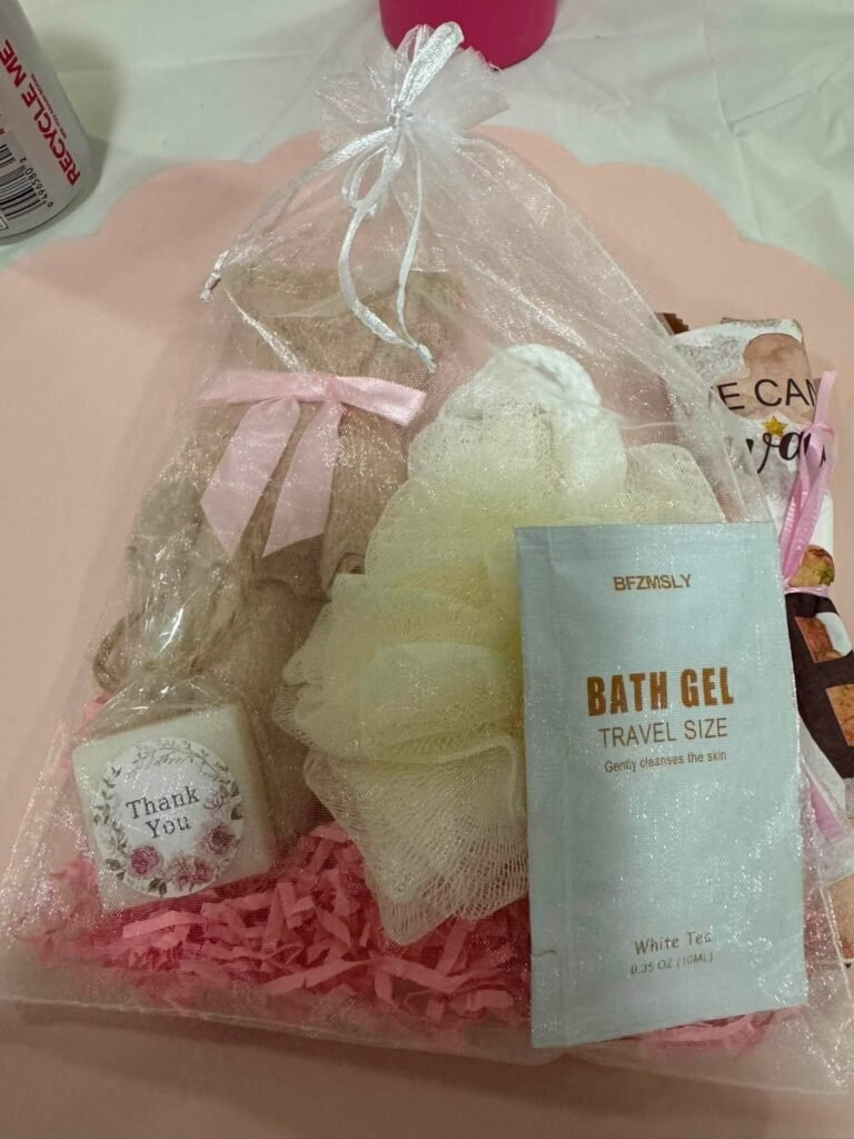 Spa favor bag with a loofah, bath gel and a thank you tag