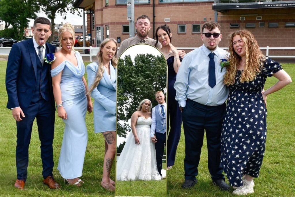 Bride and bridal party posing on a lawn with blue bridesmaid dresses