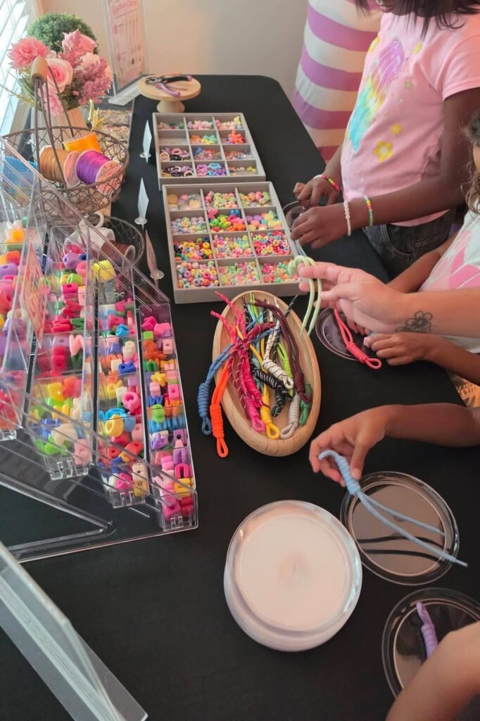 Kids picking charms at the craft table