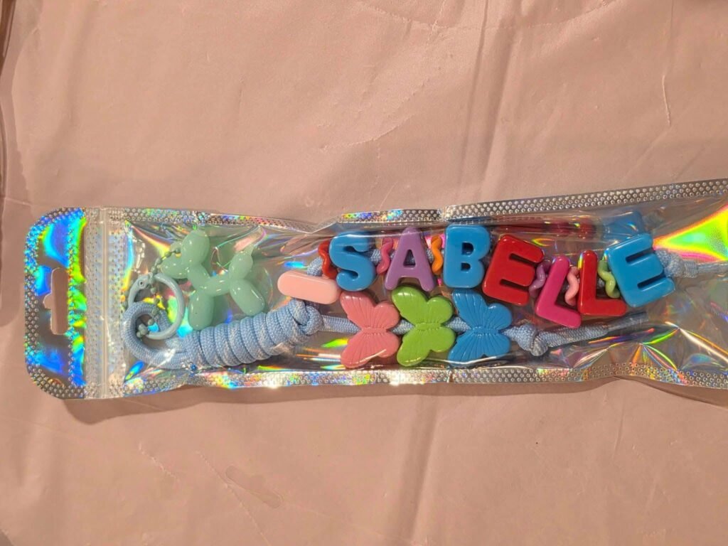 Finished keychain with letters in a clear bag