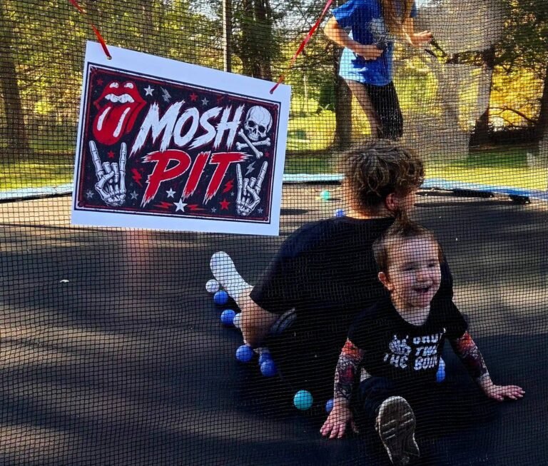 Mosh Pit sign on a trampoline with kids jumping