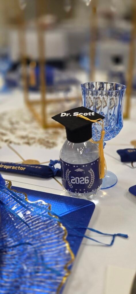 Mini graduation cap favor on a blue place setting