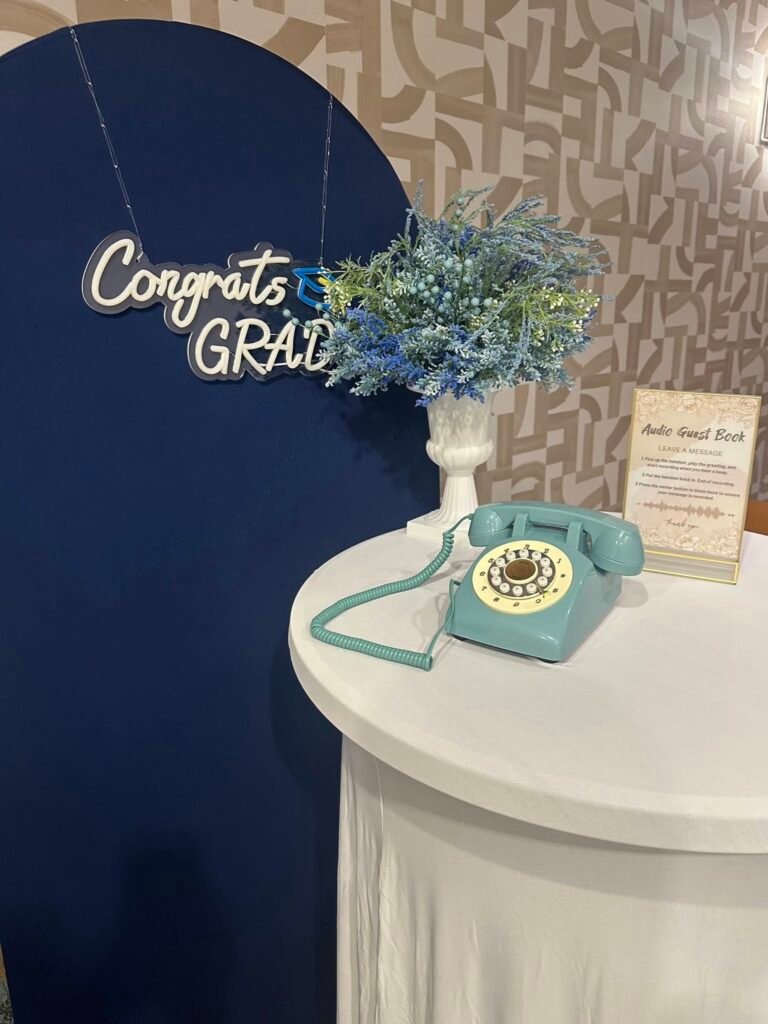 Congrats Grad navy arch with a vintage phone audio guest book