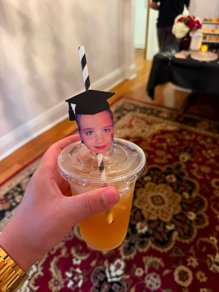 Drink cup with a grad photo face cutout on the straw