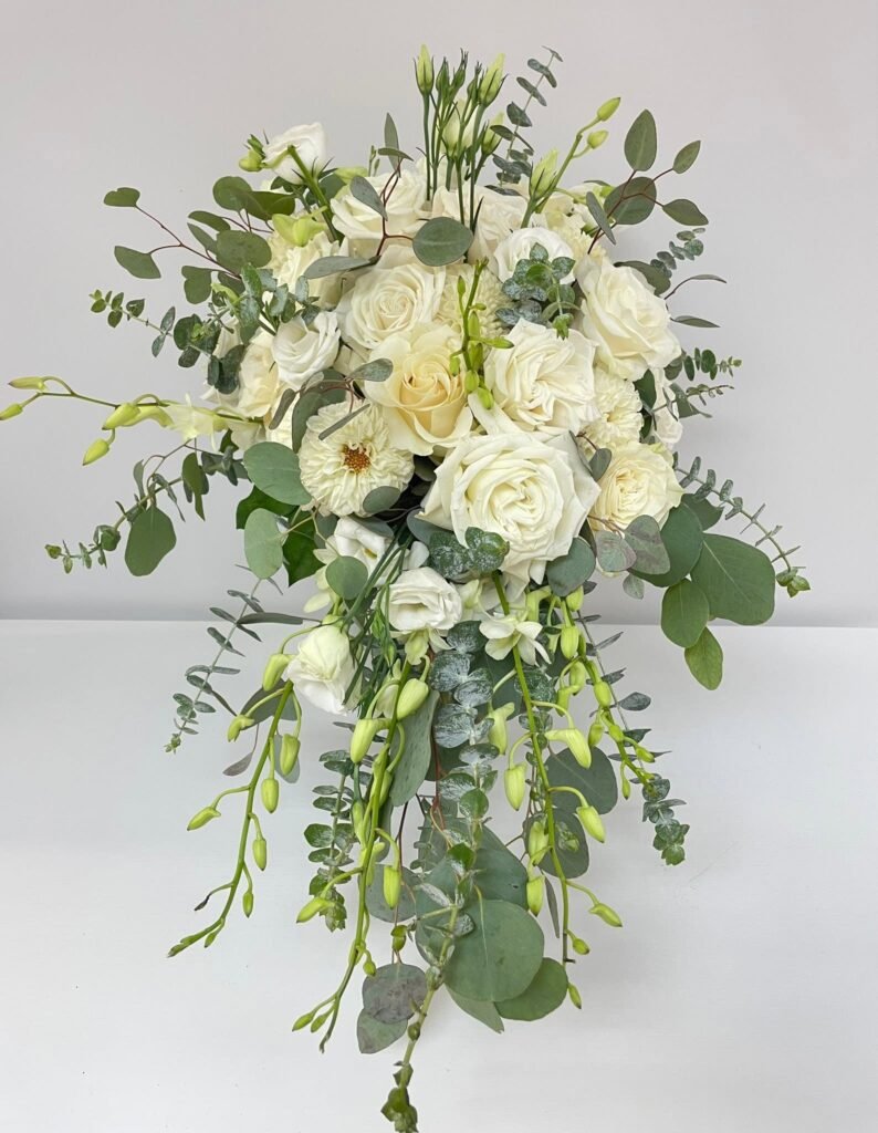 Cascading white bridal bouquet with greenery