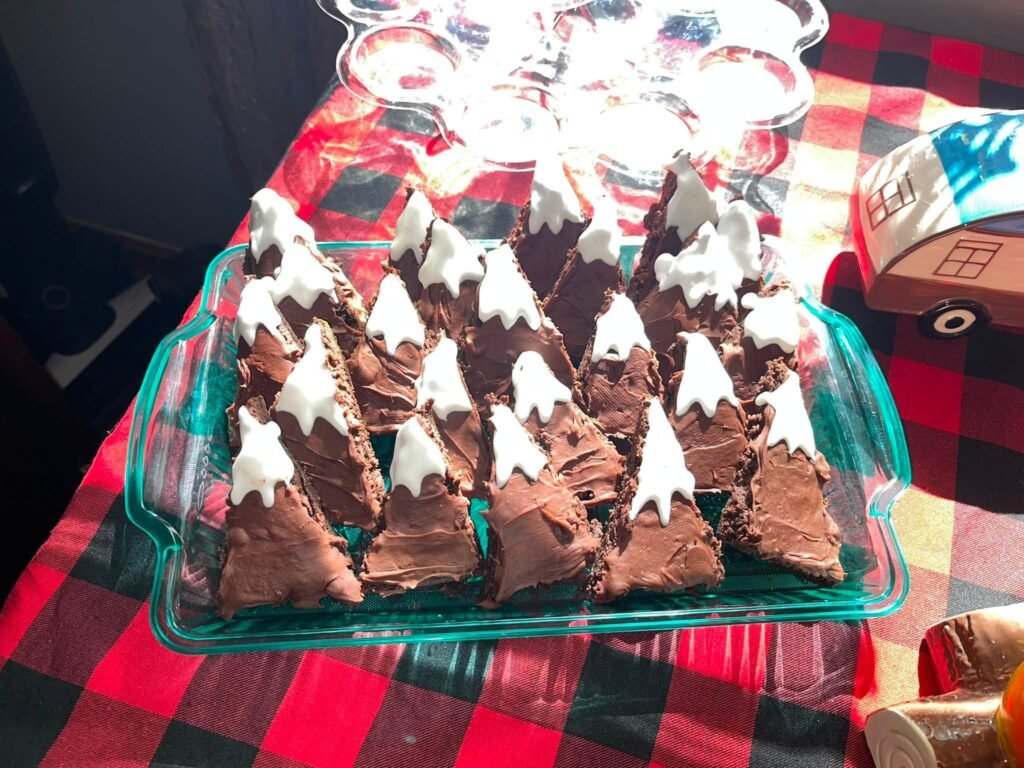 Brownies with white tops shaped like snowy mountains
