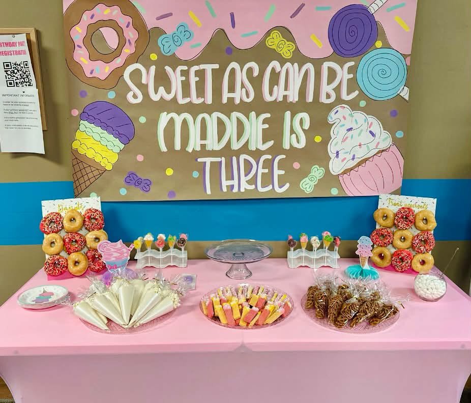 Sweet as Can Be sign over a pink dessert table