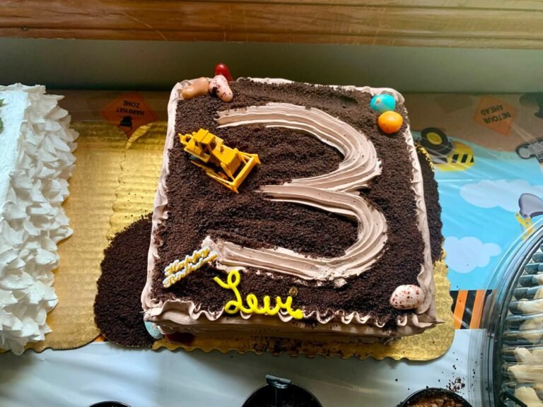 Chocolate dirt number 3 birthday cake with an excavator topper