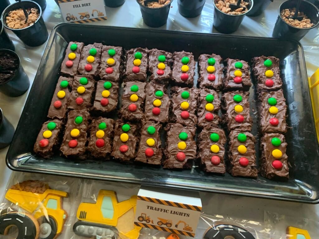 Brownies with red, yellow and green candy traffic lights on a tray