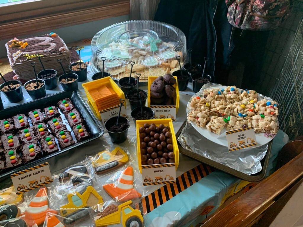 Dessert spread with cones, brownies, cookies and covered cake stands