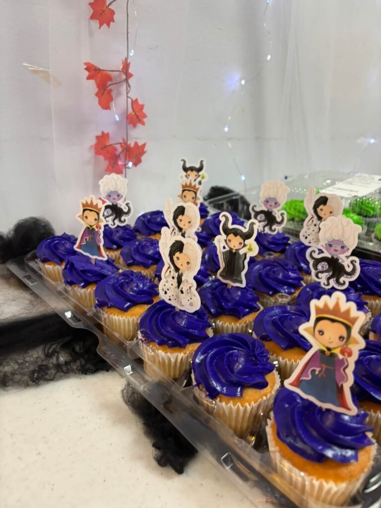 Purple cupcakes with villain toppers