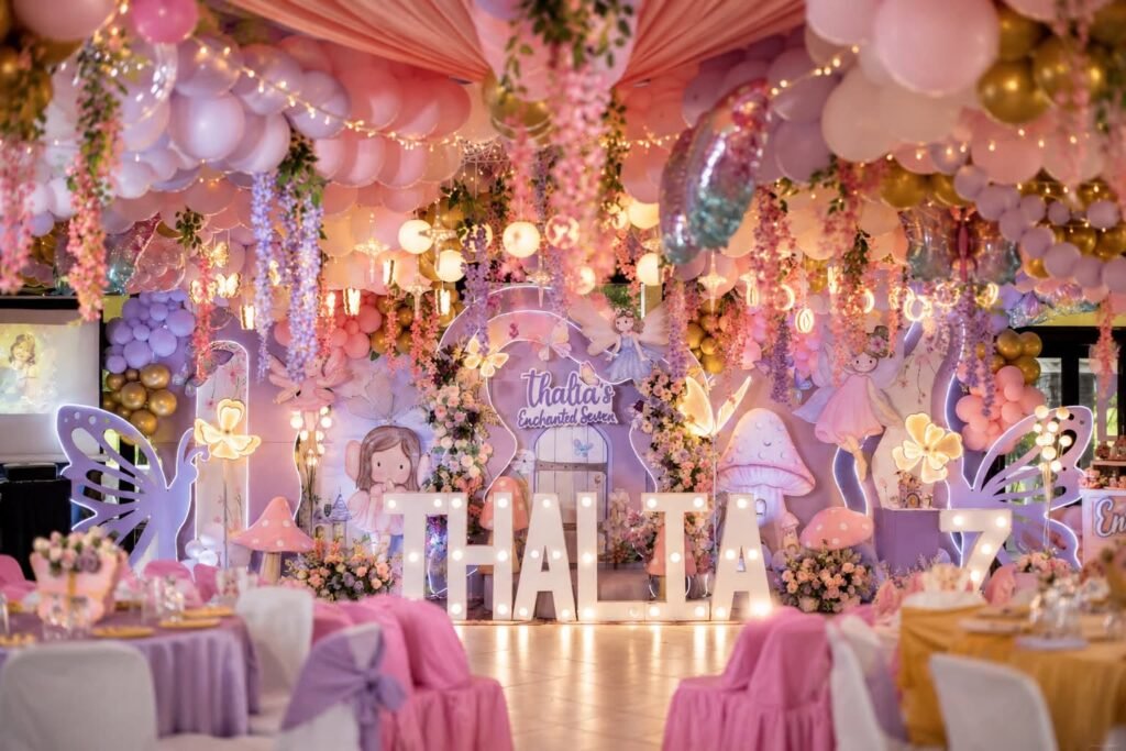 Wide view of a fairy party hall with pink tables and a lilac stage
