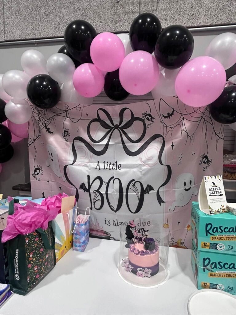 Little Boo baby shower sign with a bow and pink, black and white balloons