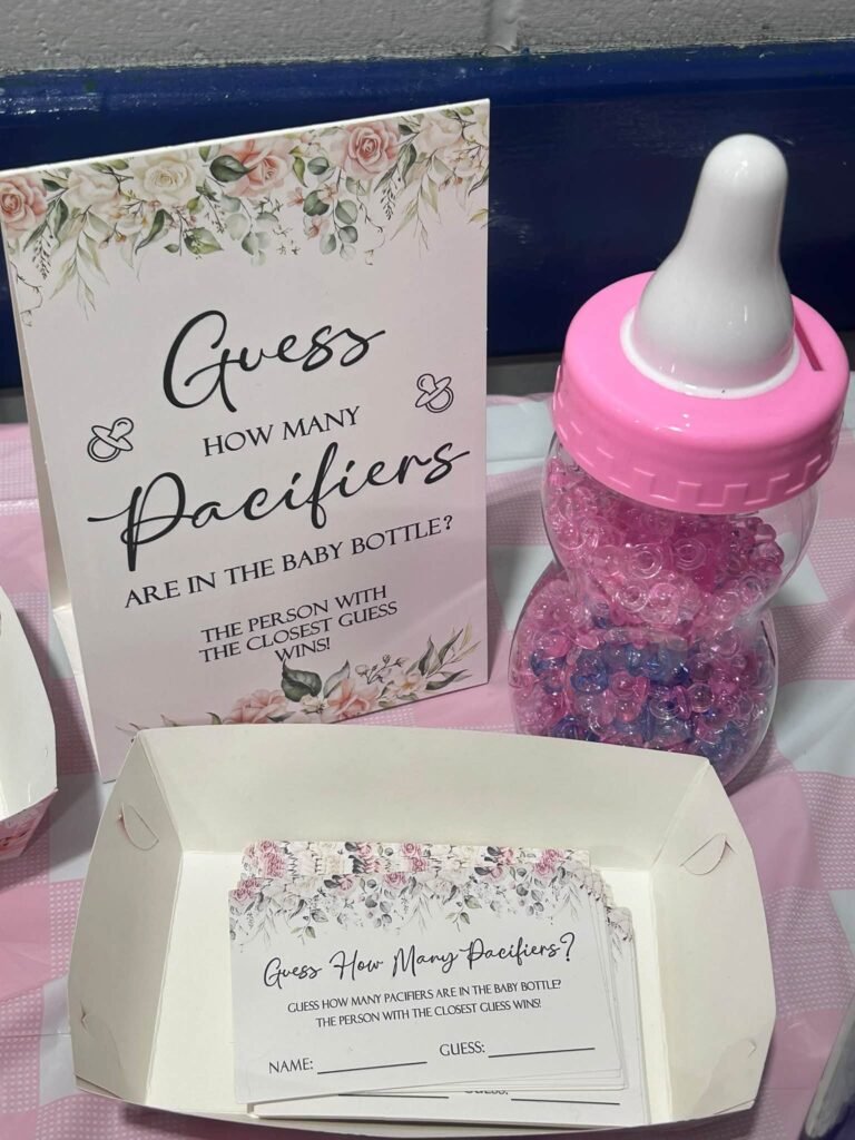 Guess how many pacifiers in the baby bottle game with a pink bottle