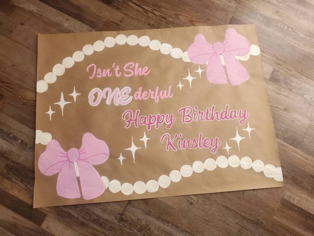 Hand painted Isnt She ONEderful banner with pink bows and pearls