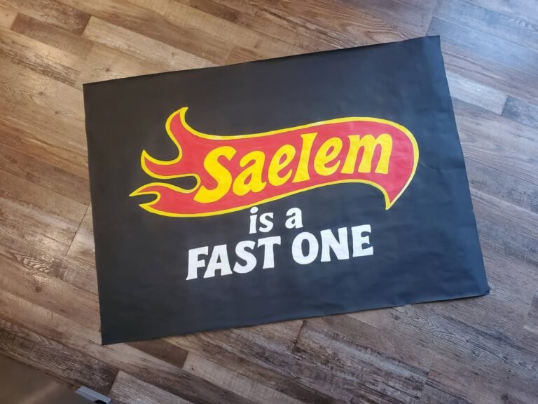 Hand painted Hot Wheels style Fast One banner on black paper