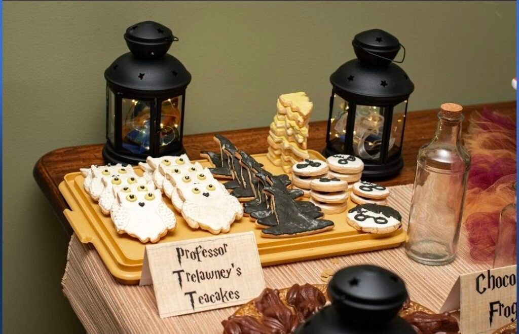 Tray of owl cookies with a Trelawney treats sign and lanterns