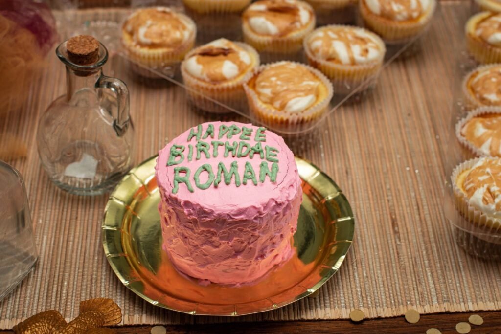 Pink smash cake with a happy birthday message