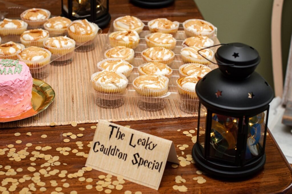 Cupcakes with a Leaky Cauldron Special sign and a lantern