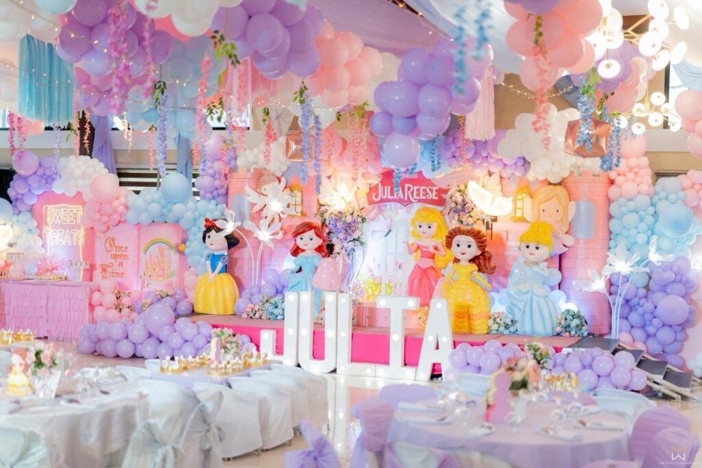 Disney princess birthday stage with light up name letters and pastel balloons