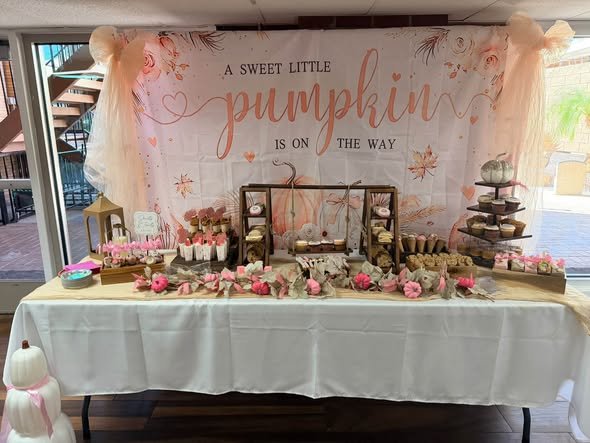 Sweet Little Pumpkin baby shower dessert table under a blush pumpkin backdrop