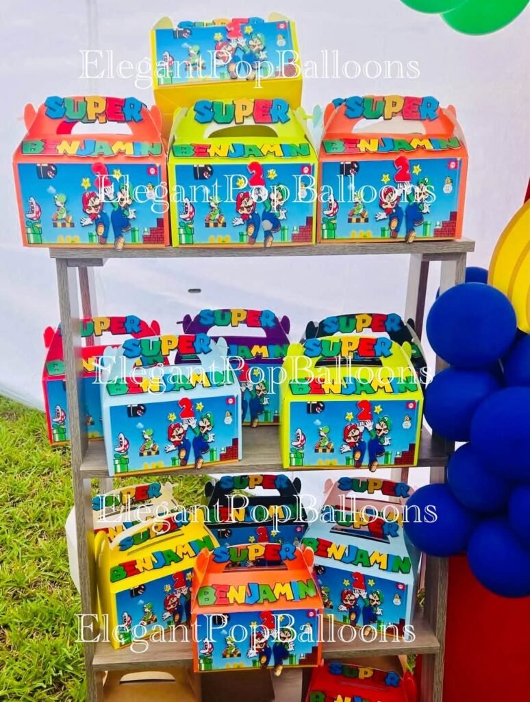 Shelf of Super Mario favor boxes next to a balloon column