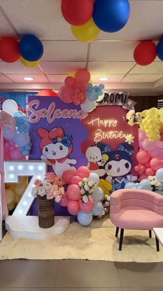 Kuromi and My Melody birthday backdrop with balloons on the ceiling and a pink chair