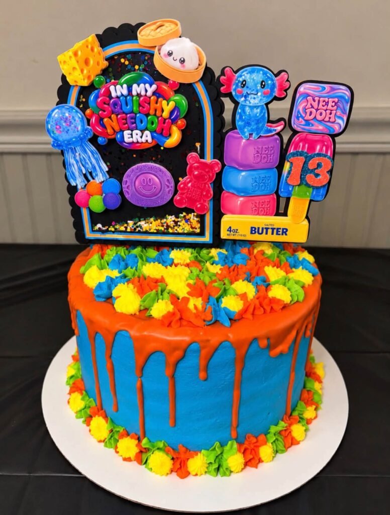 Neon drip birthday cake with rainbow buttercream and Nee Doh toppers