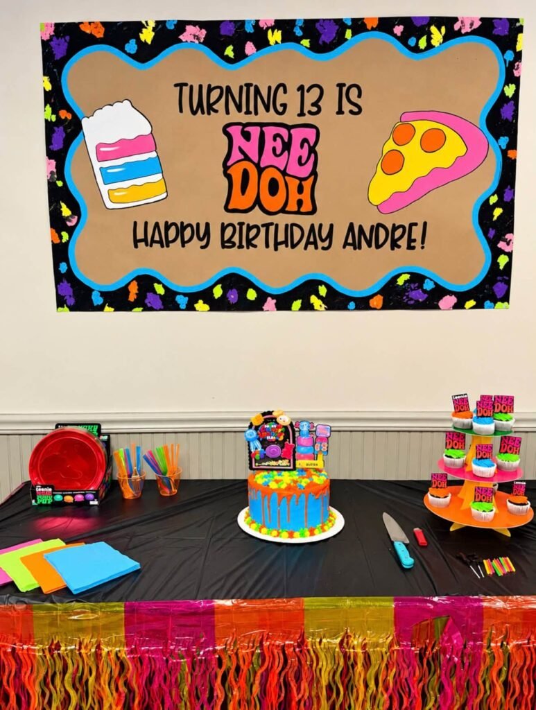 Turning 13 is Nee Doh Happy Birthday banner over the cake and cupcakes