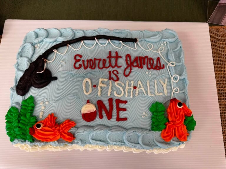 O-fish-ally One sheet cake with a fishing rod, fish and seaweed in buttercream