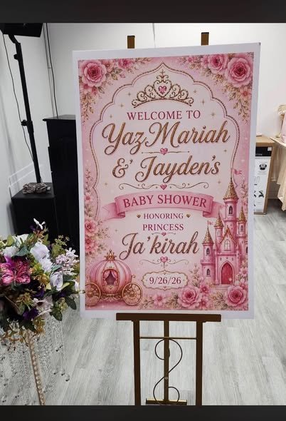 Pink floral princess baby shower welcome sign on an easel